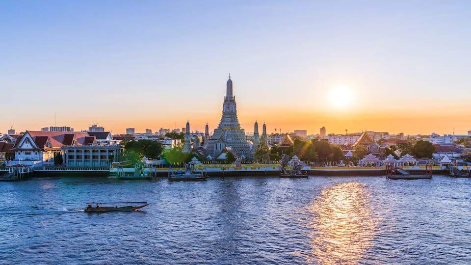 Thai Temple at Chao Phraya River Side, Sunset at Wat Arun Temple in Bangkok Thailand. Wat Arun is a Buddhist temple in Thon Buri District of Bangkok, Wat Arun is among the best known of Thai.