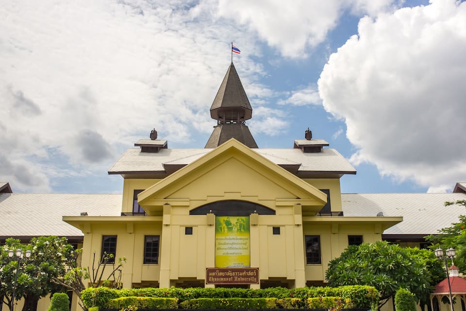 A building with a pointed roof and a flag on top.