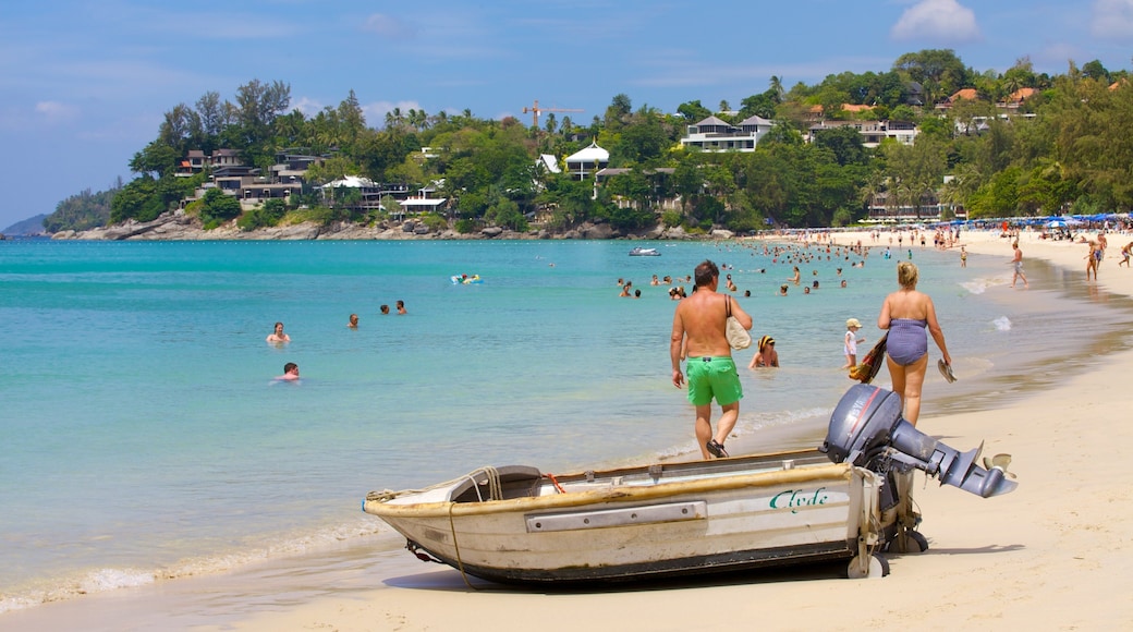 Playa Kata Noi mostrando una playa de arena, vistas generales de la costa y natación