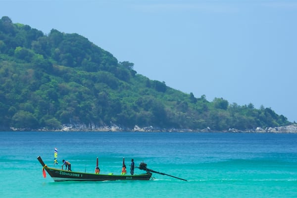 Kata Noi Beach featuring boating, rocky coastline and a bay or harbour