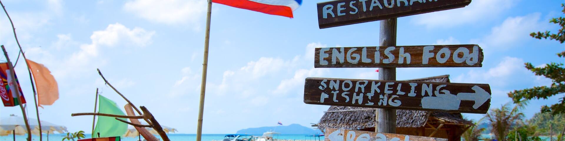 Thong Kut Beach featuring tropical scenes, signage and a beach
