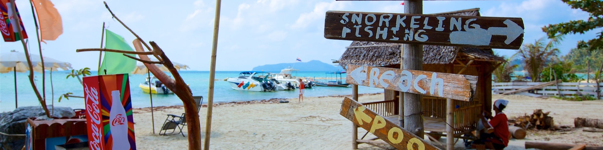 Thong Kut Beach featuring tropical scenes, signage and a beach