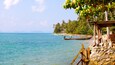 Pangka Beach which includes a pebble beach, a beach and tropical scenes