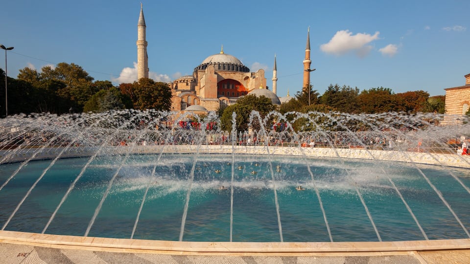 Hagia Sophia featuring a pond, a fountain and heritage architecture