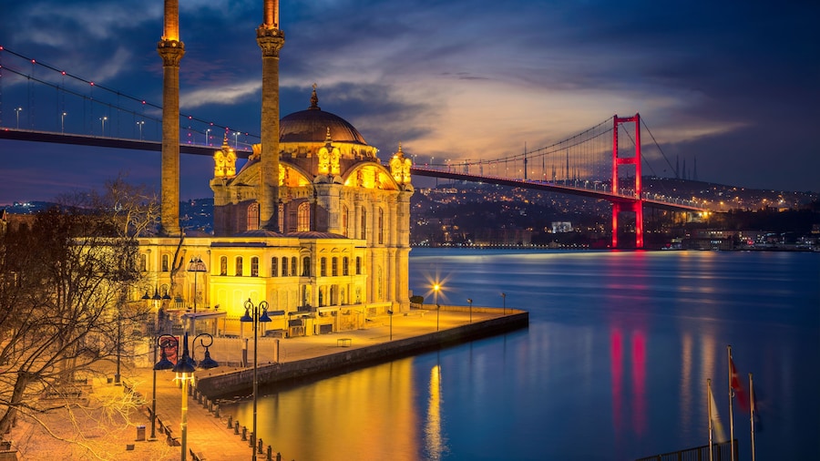 Istanbul. Image of Ortakoy Mosque with Bosphorus Bridge in Istanbul during twilight blue hour.