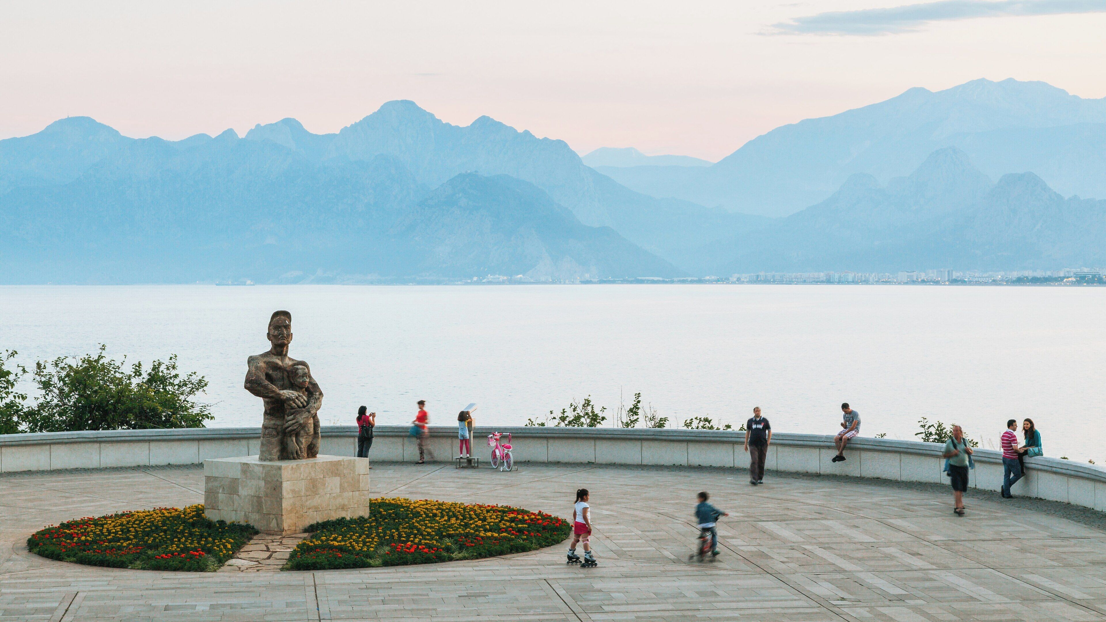 Karaalioglu Park in Antalya City Centre offers stunning views of the coastline and mountains as visitors enjoy the tranquil atmosphere during the evening