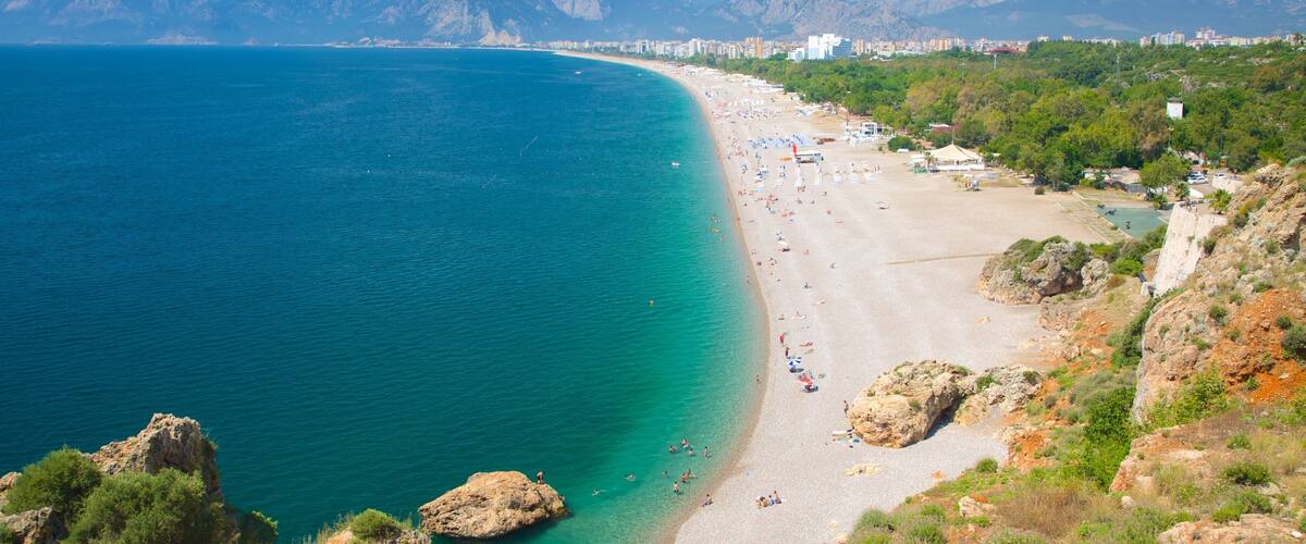 Konyaalti Beach Park featuring a sandy beach, a coastal town and landscape views