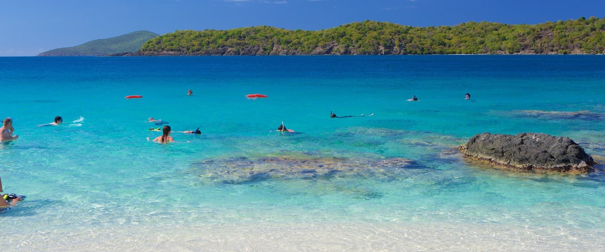 Coki Beach featuring tropical scenes, swimming and a sandy beach