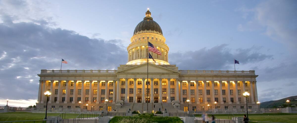 Utah State Capitol showing heritage architecture, a sunset and an administrative buidling