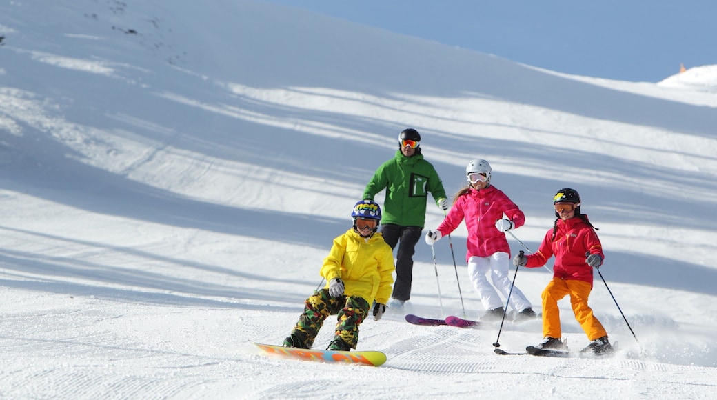 Park City Mountain Resort featuring snow skiing and snow as well as a family