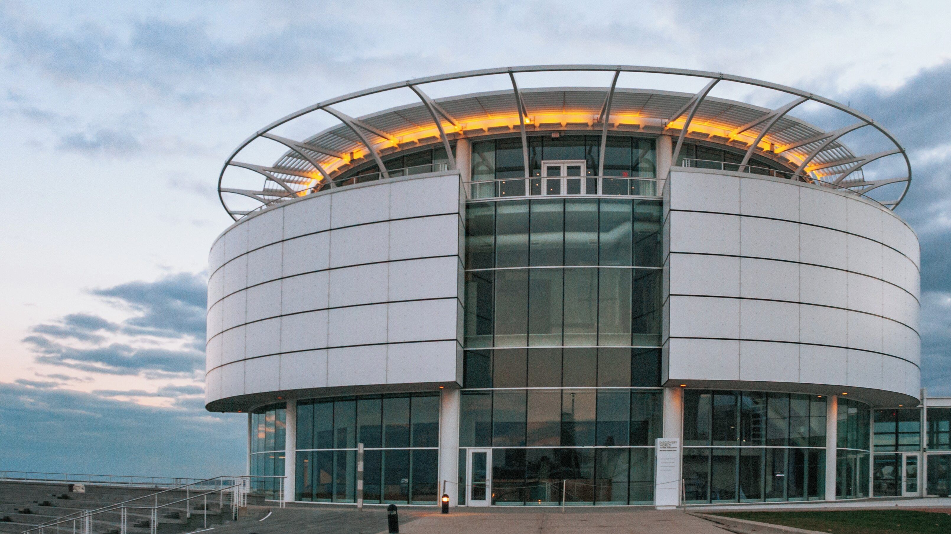 Exploring Discovery World in East Town Milwaukee, Wisconsin showcasing interactive exhibits and stunning lakefront views during twilight hours