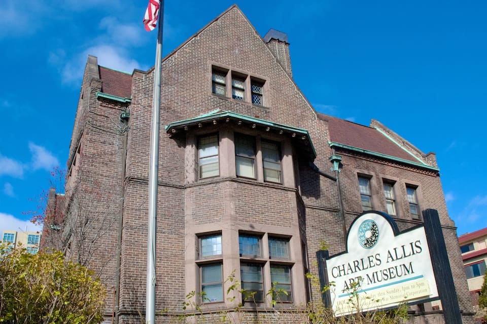 A historic building with a sign for the Charles Allis Art Museum.