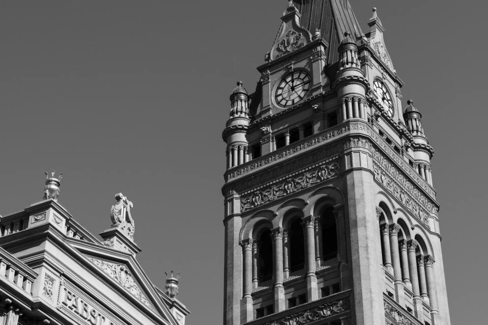 A historic building with a clock tower and ornate architectural details.