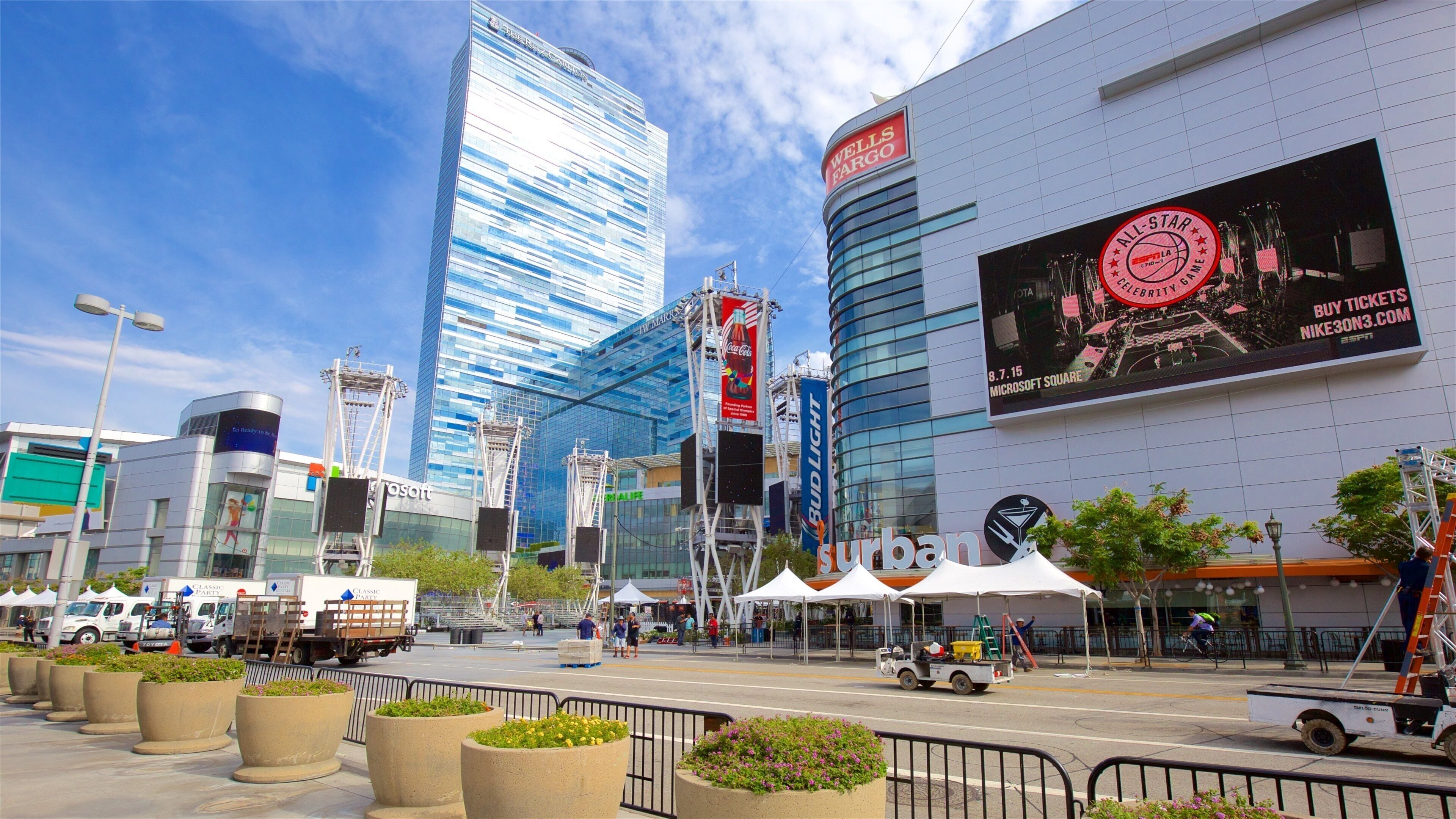 Staples Center which includes modern architecture, signage and a city