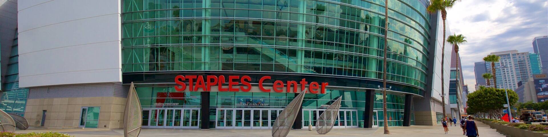 The Staples Center building with large glass windows and a curved facade.