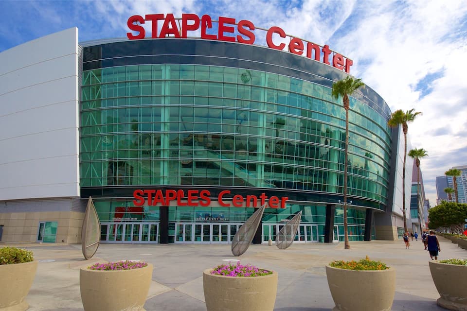The Staples Center building with large glass windows and a curved facade.