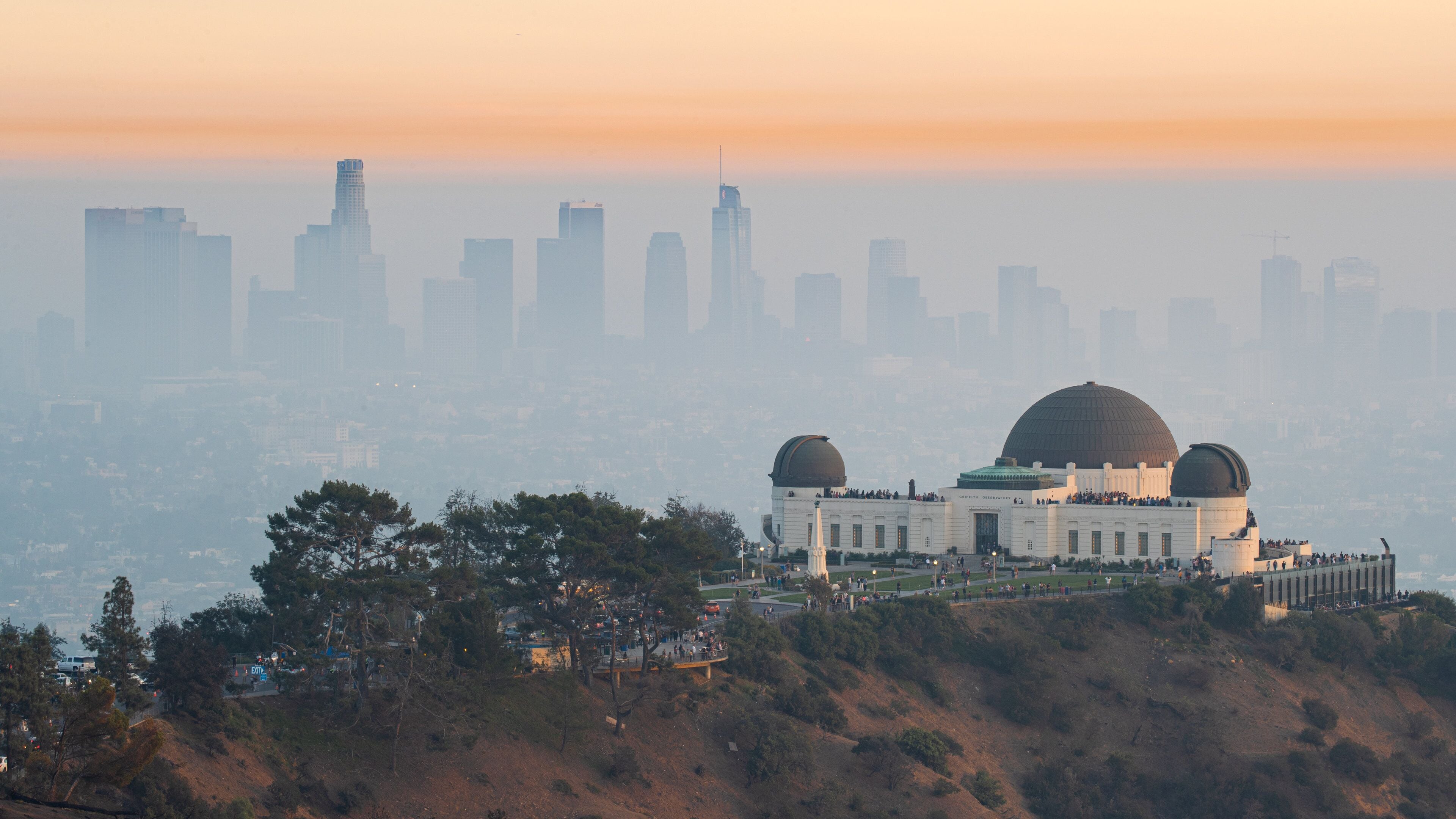 Griffith Observatory showing mist or fog, a city and landscape views