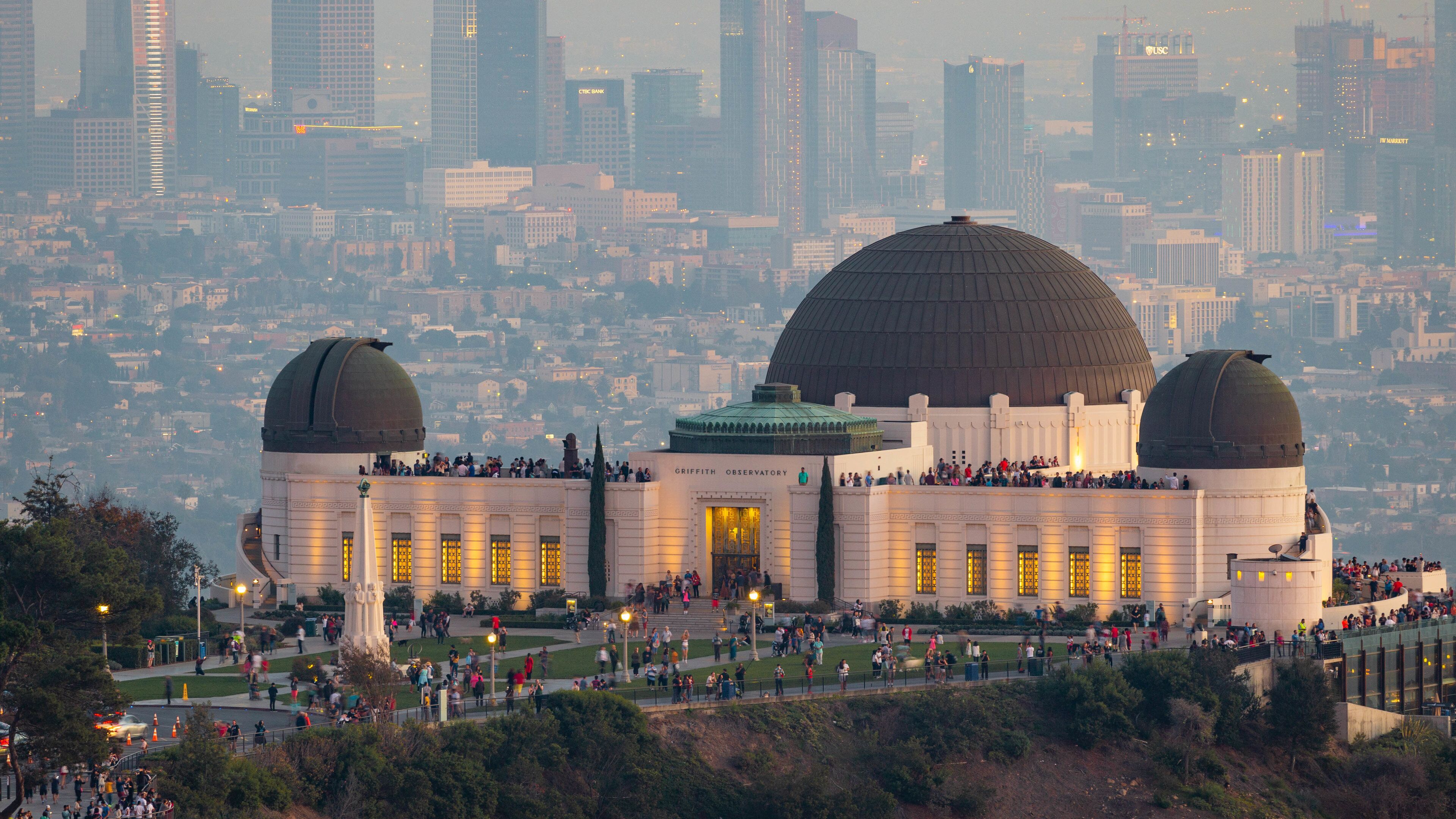 Griffith Observatory showing a city, an observatory and landscape views