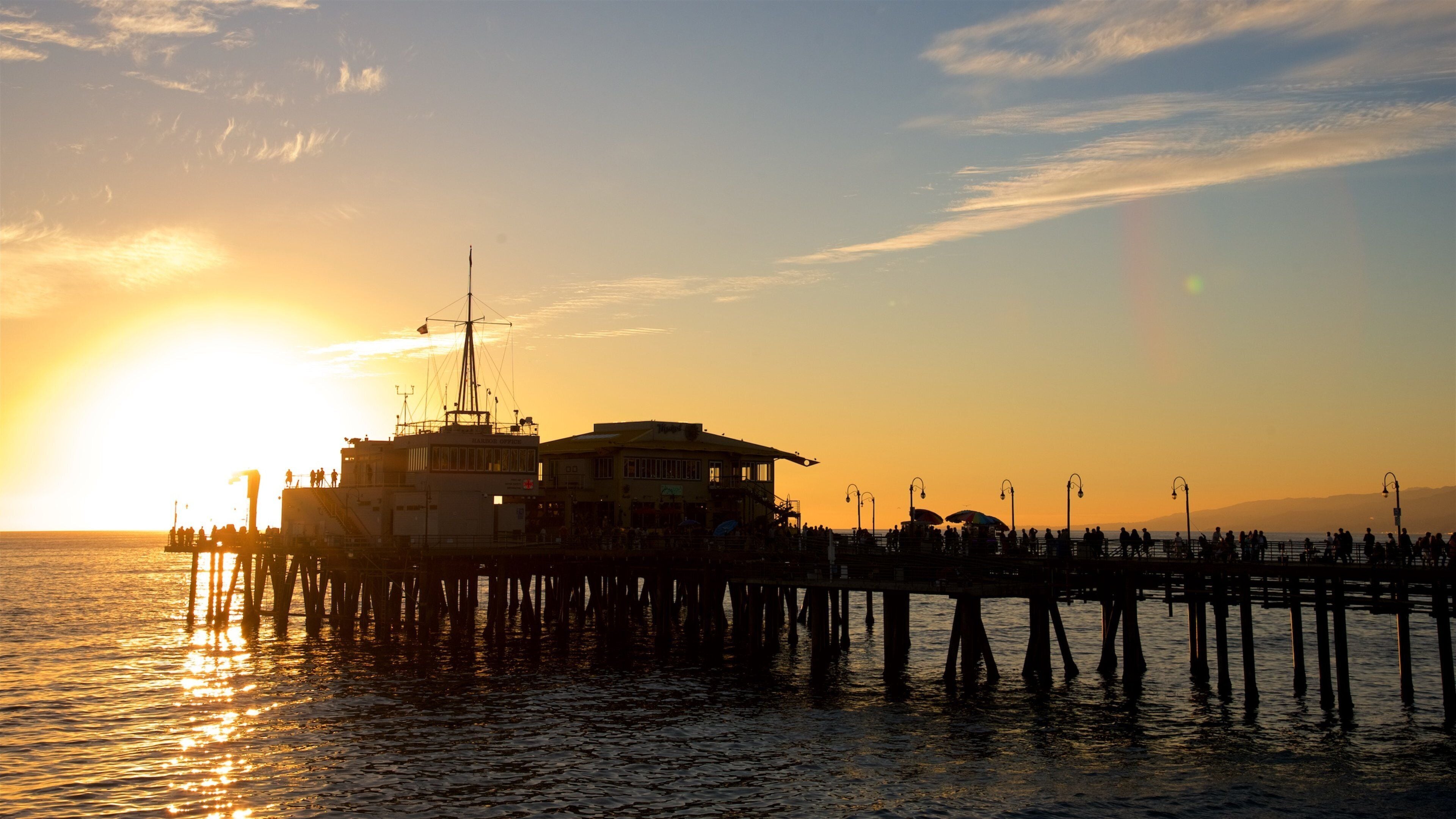 Santa Monica Pier showing general coastal views and a sunset