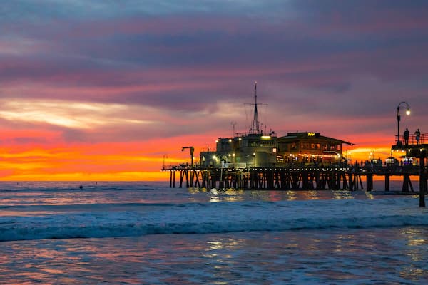 Santa Monica Pier which includes a sunset and general coastal views