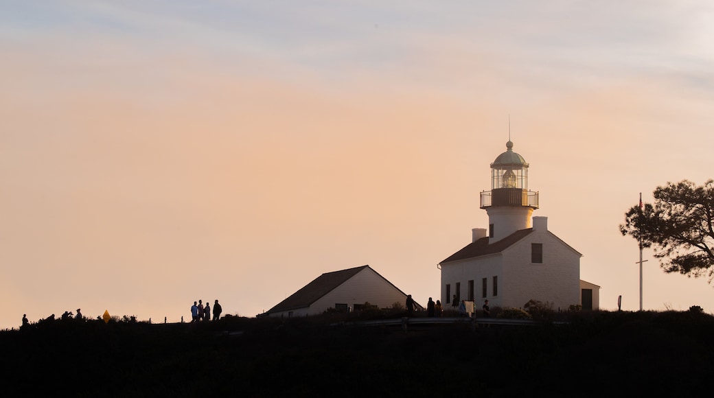 Point Loma Lighthouse which includes a lighthouse and a sunset