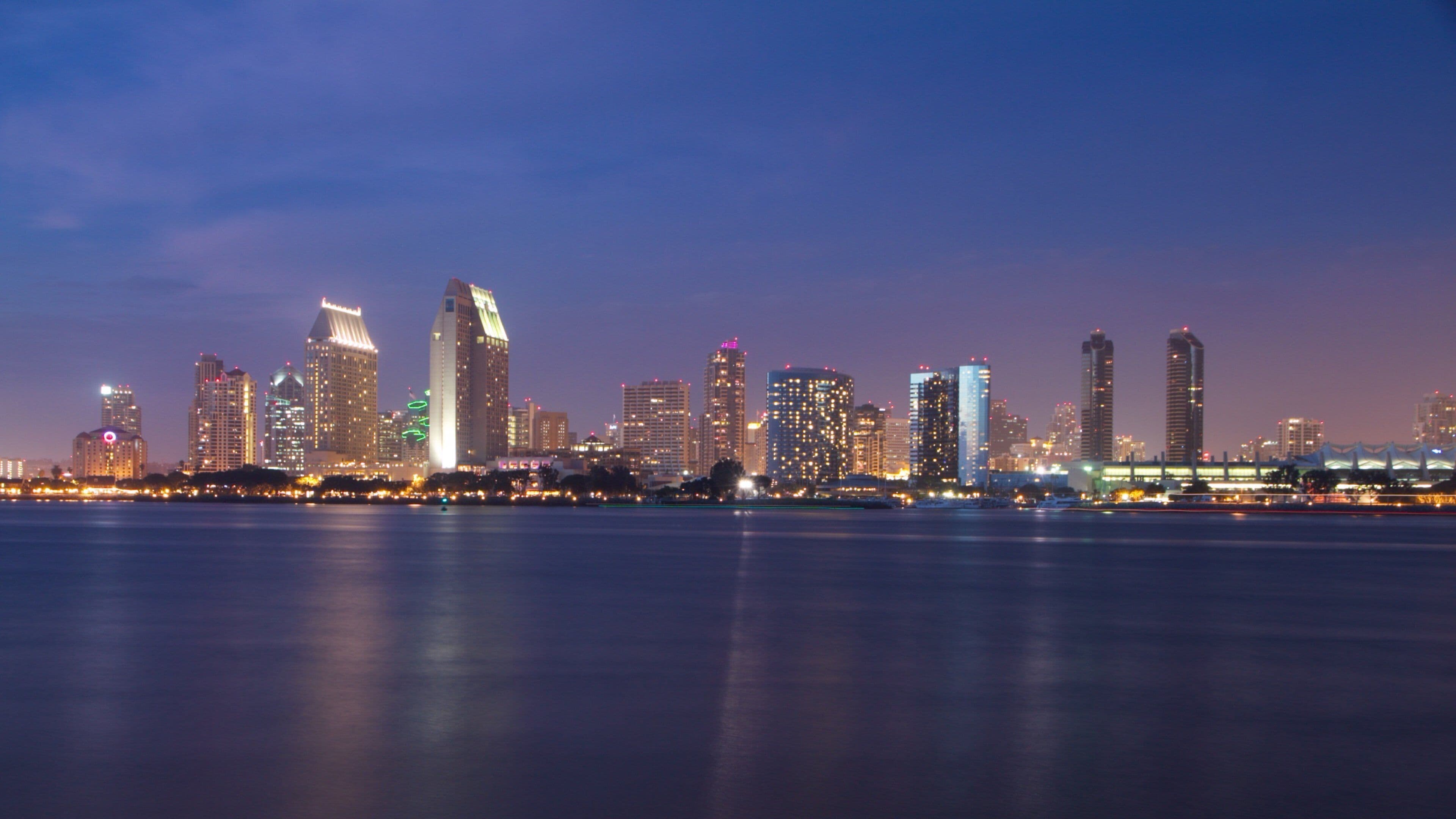Coronado Beach featuring general coastal views, night scenes and a skyscraper
