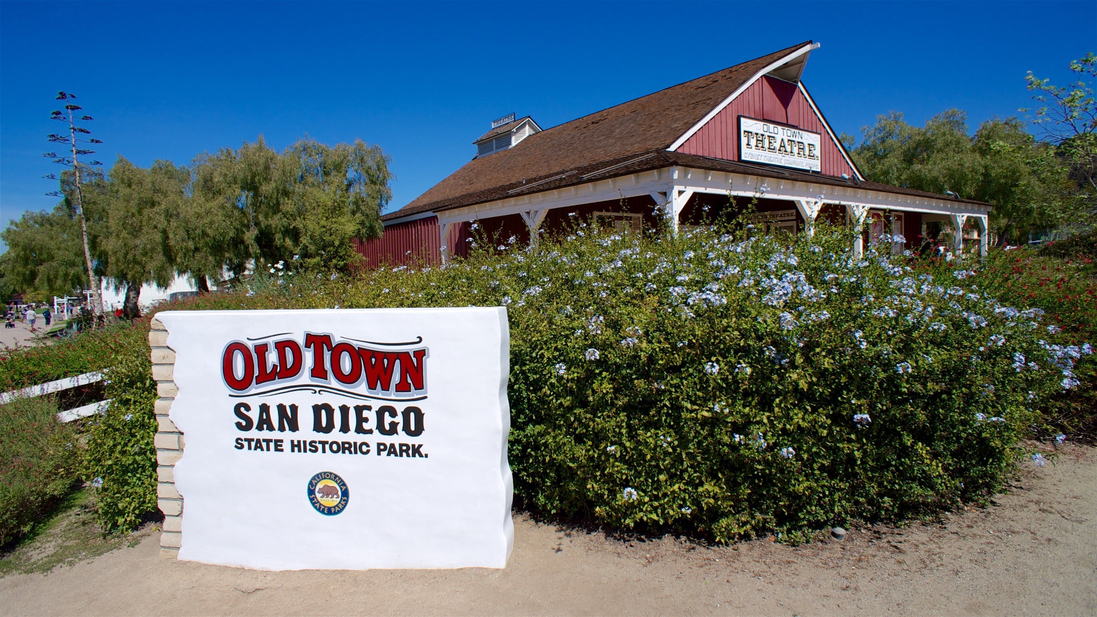 Old Town San Diego State Park which includes signage and wildflowers