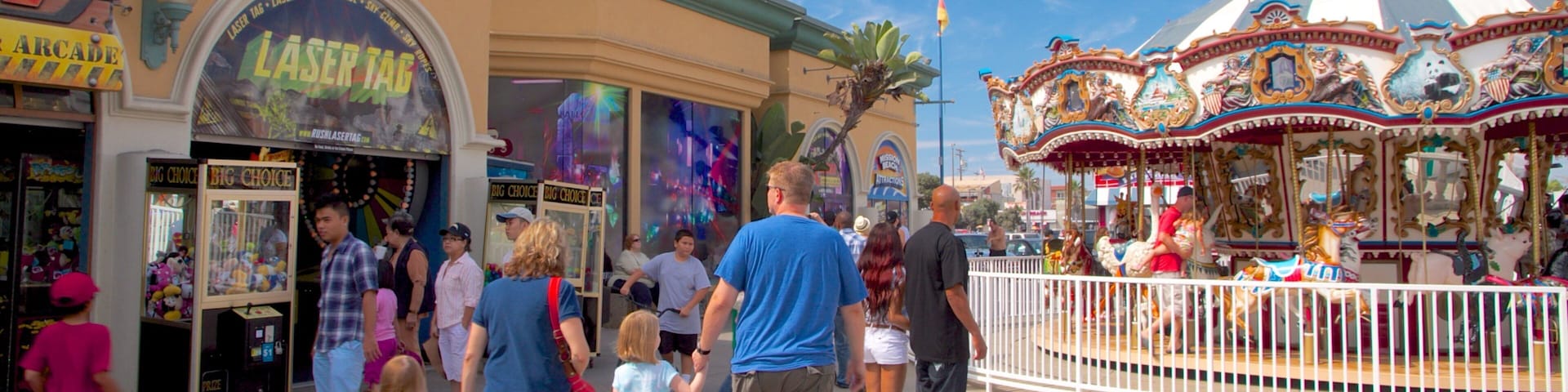 Belmont Park featuring rides and a garden as well as a family