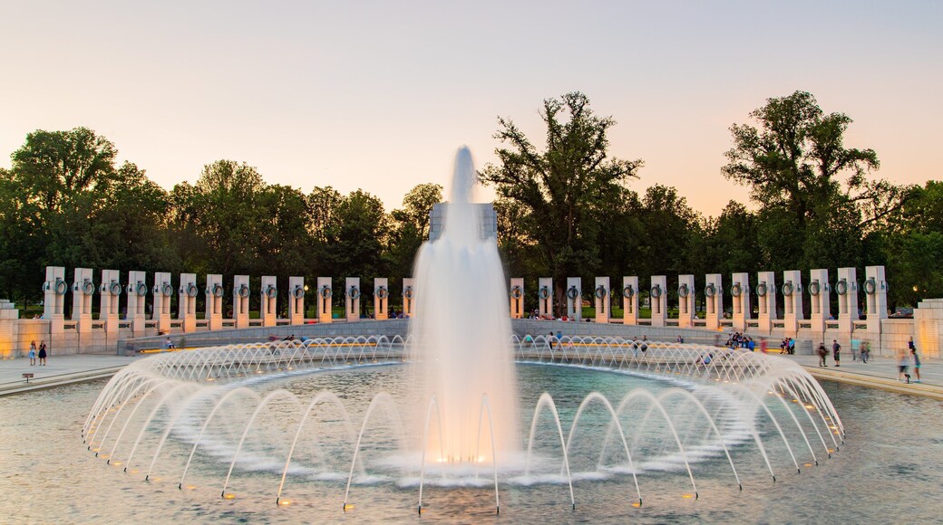 National World War II Memorial showing a fountain and a sunset