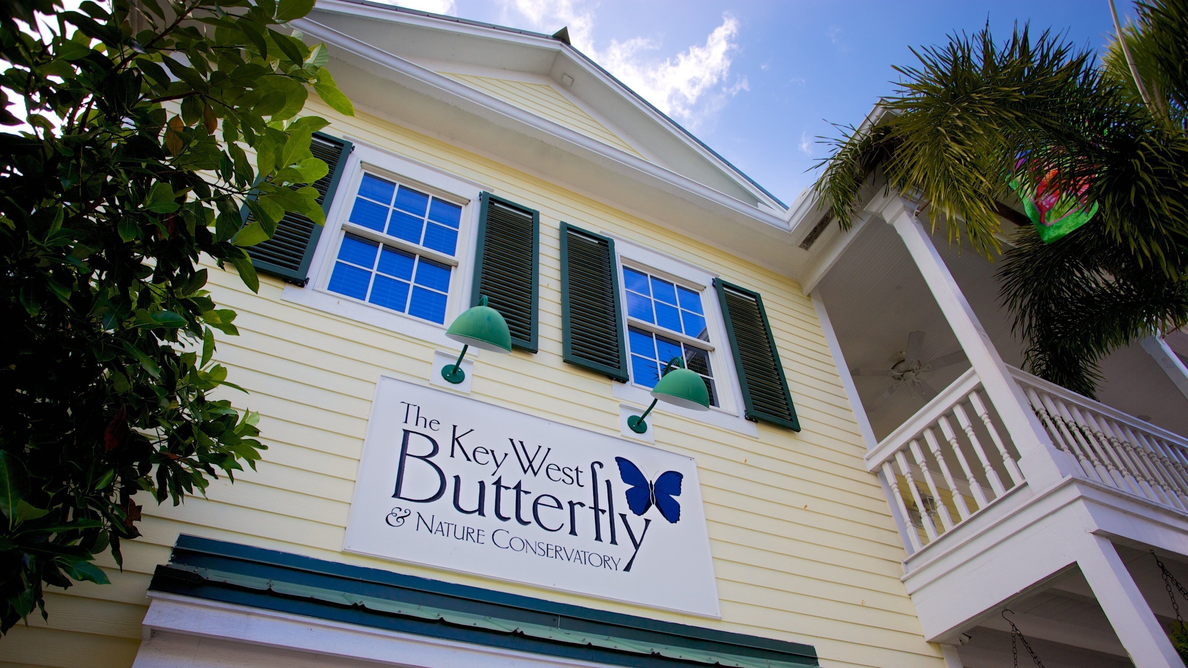 A building with a sign reading "The Key West Butterfly & Nature Conservatory".