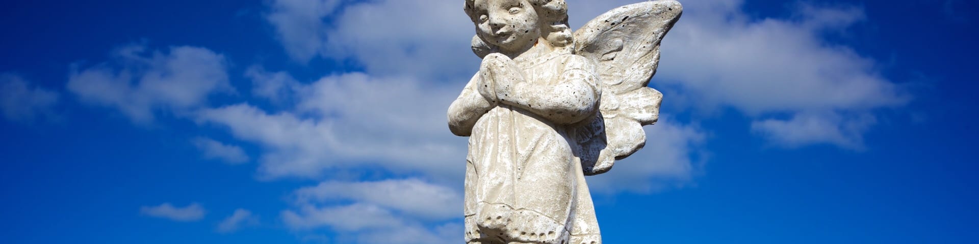 Key West Cemetery showing a cemetery, a statue or sculpture and a small town or village