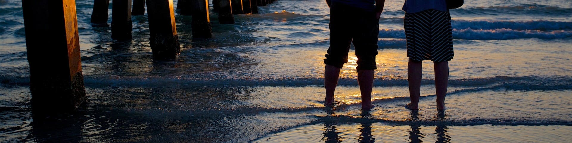 Naples Pier featuring a sunset, a beach and views