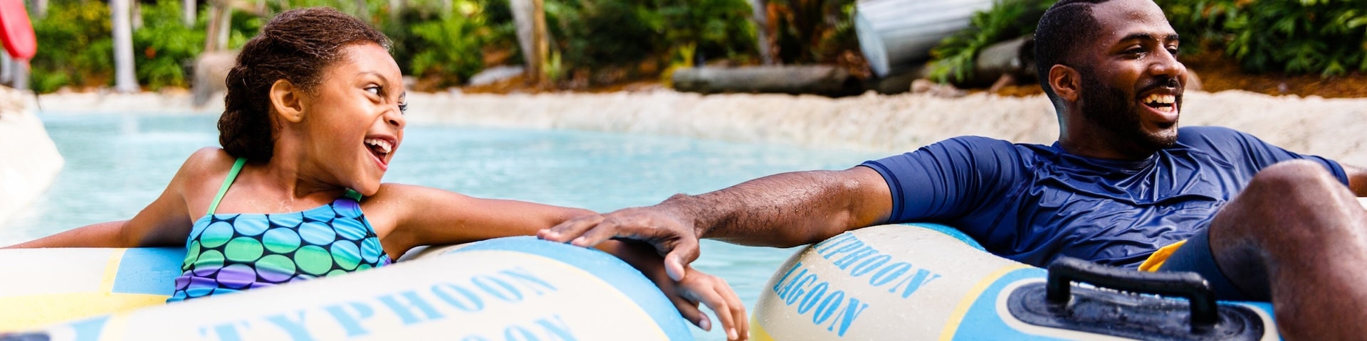 Disney\'s Typhoon Lagoon Water Park showing rafting and a waterpark as well as a family