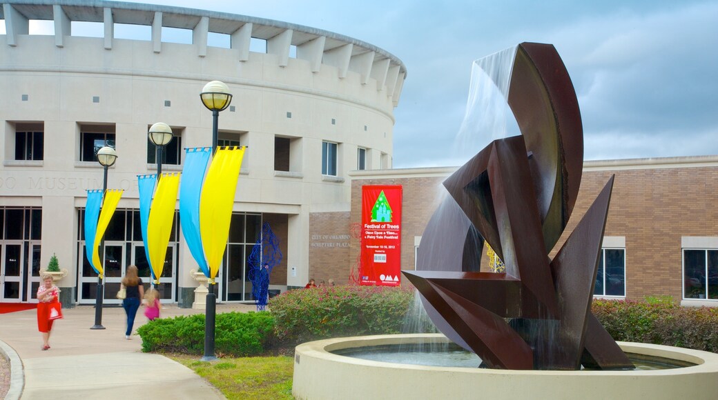 Orlando Museum of Art showing outdoor art and a fountain