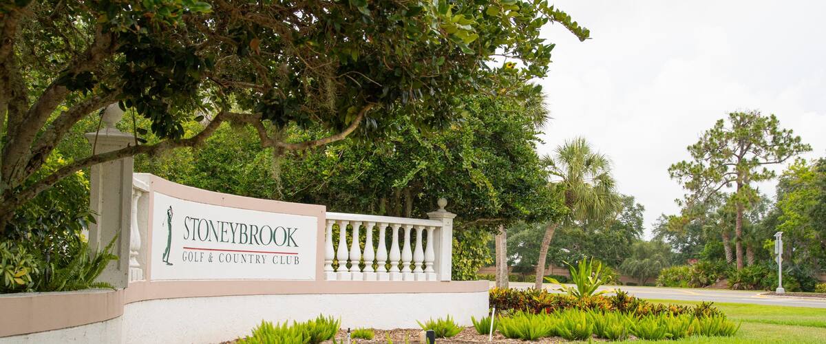 Stoneybrook Golf & Country Club which includes signage and a garden