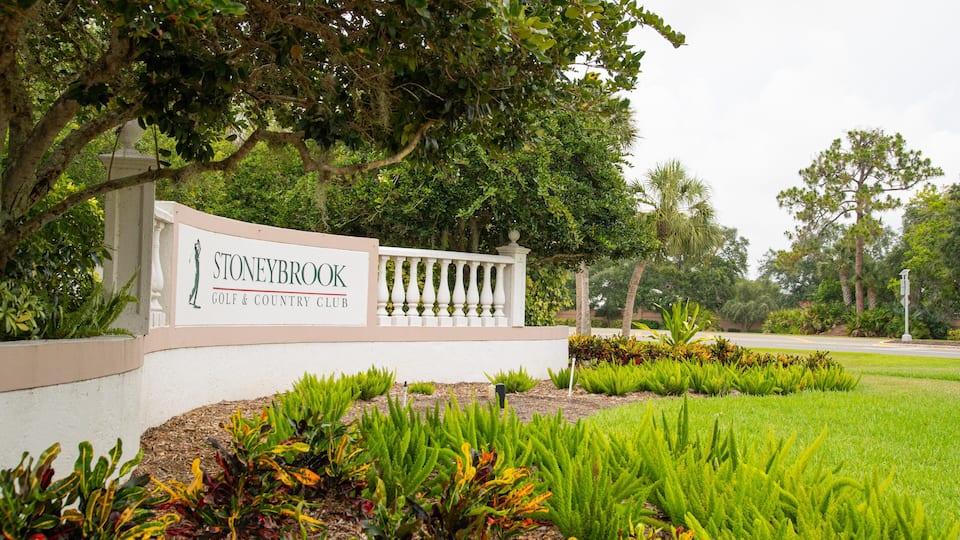 Stoneybrook Golf & Country Club which includes signage and a garden