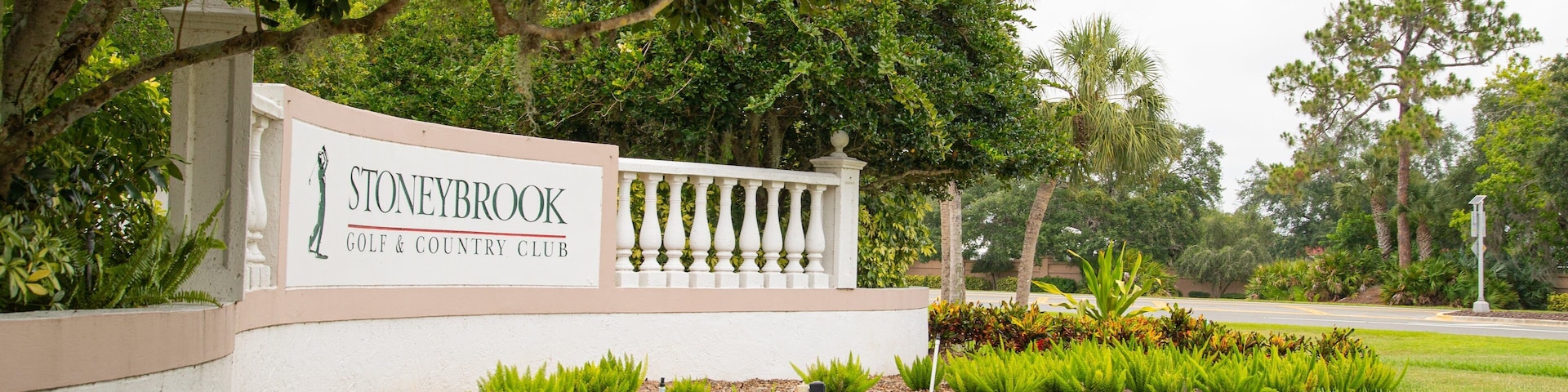 Stoneybrook Golf & Country Club which includes signage and a garden
