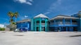 A blue building with a sign that reads "MOTE AQUARIUM" and "Marine Mammal Research and Rehabilitation Center".