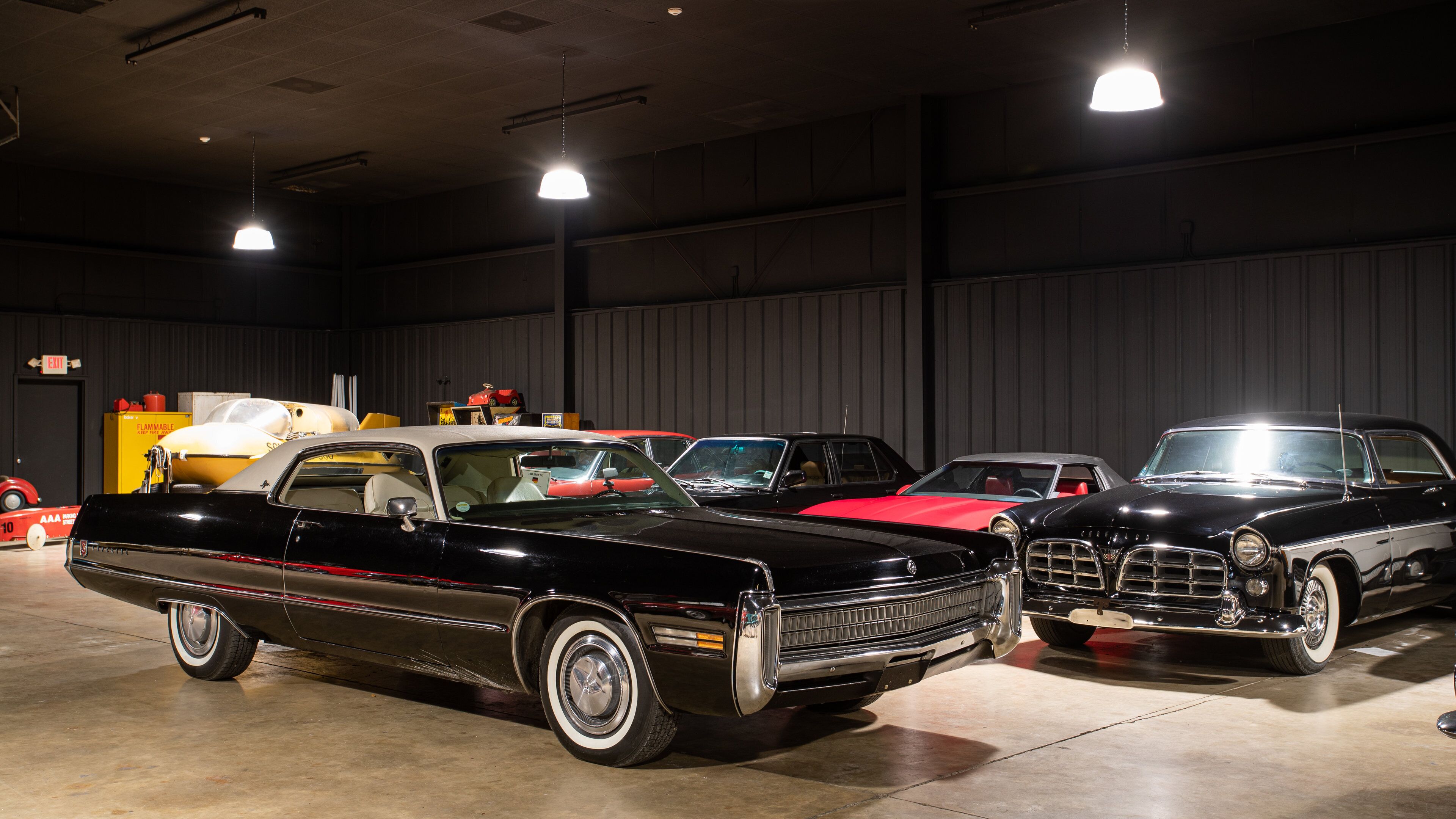 A vintage car exhibition with classic cars on display.
