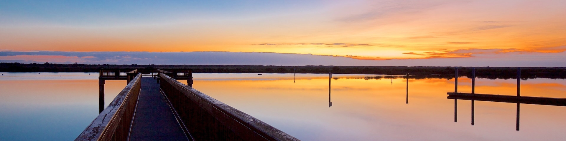 St. Augustine Lighthouse & Maritime Museum showing general coastal views and a sunset