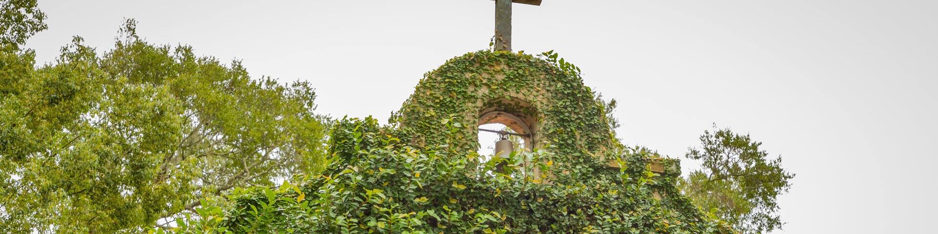 Mission of Nombre de Dios which includes religious aspects, a statue or sculpture and a park