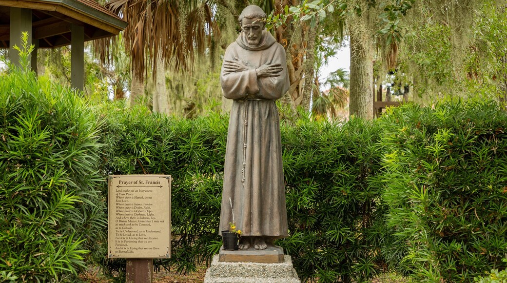 Mission of Nombre de Dios featuring a statue or sculpture and religious elements