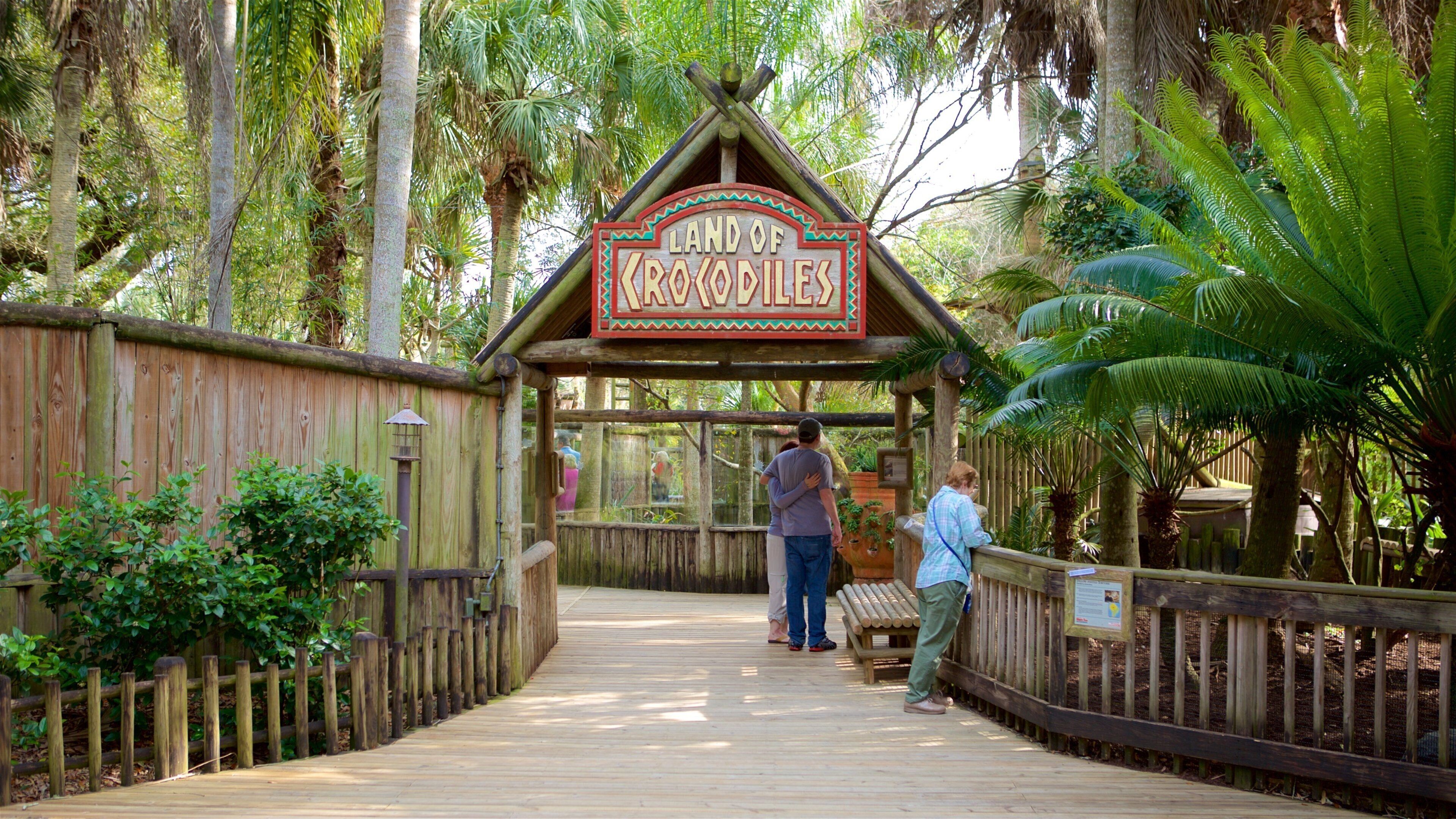 St. Augustine Alligator Farm Zoological Park showing signage and zoo animals as well as a small group of people