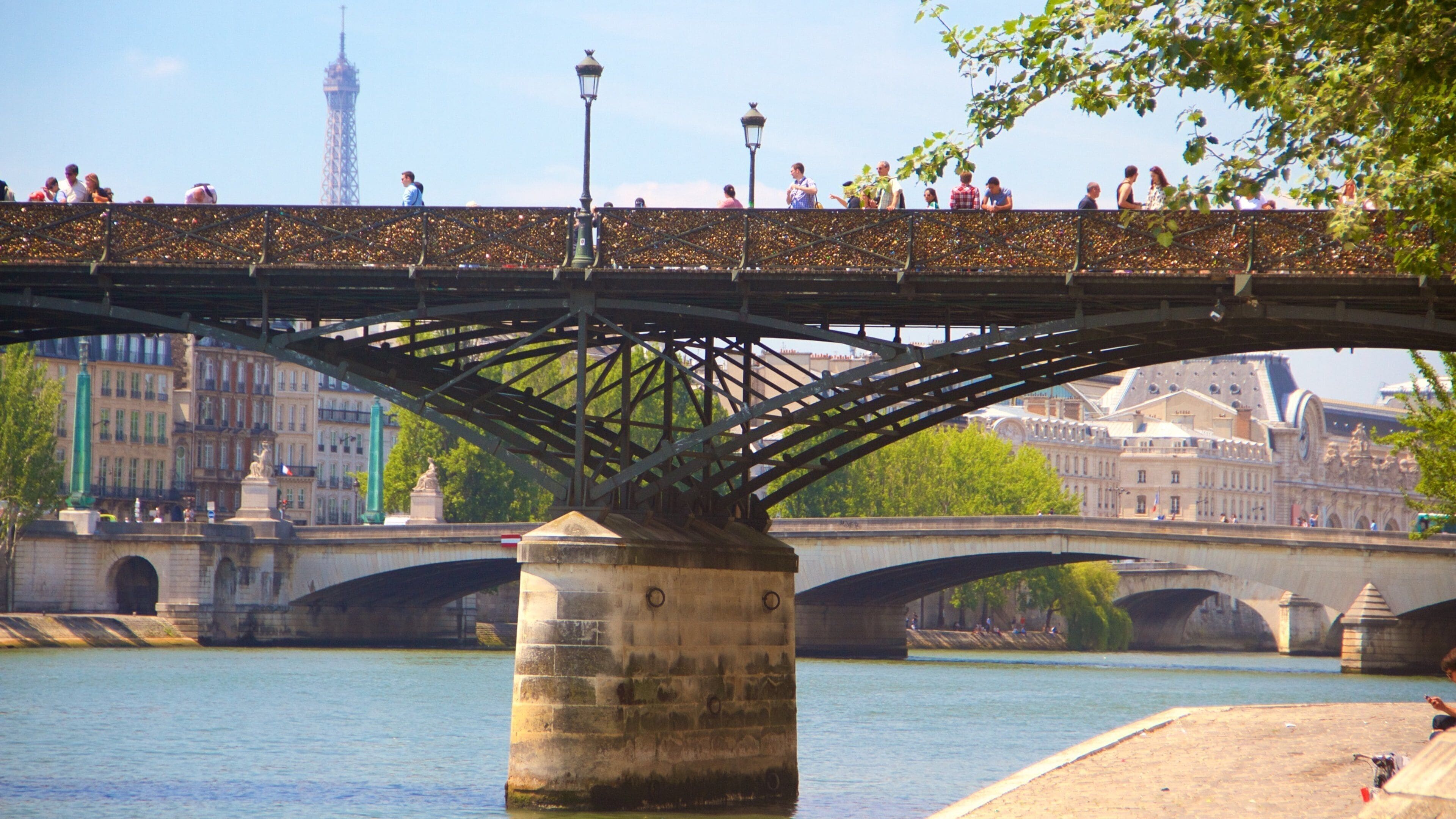Pont des Arts featuring a bridge, a river or creek and a city