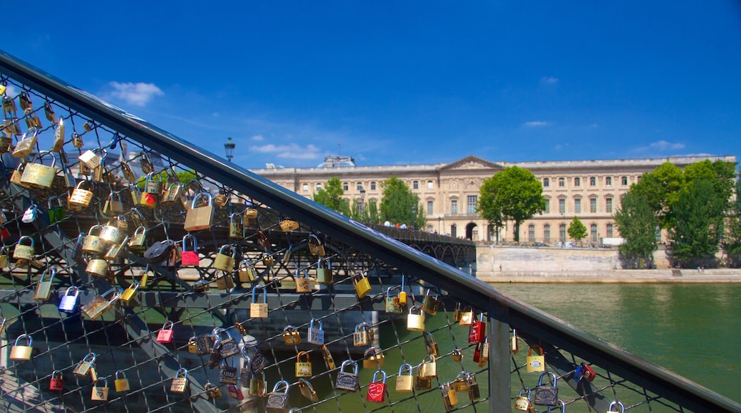 Pont des Arts featuring a bridge, a river or creek and a city