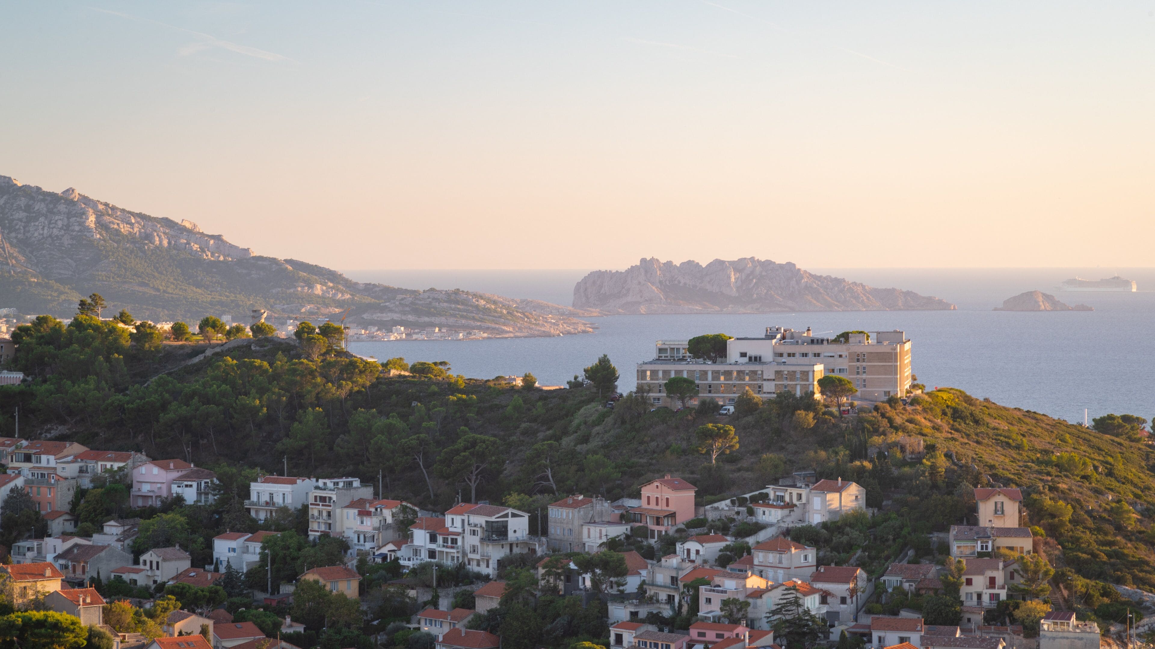 Notre-Dame de la Garde featuring general coastal views, a coastal town and a sunset
