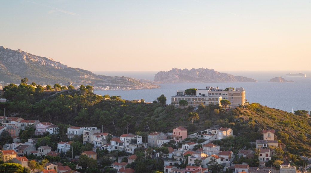 Notre-Dame de la Garde featuring general coastal views, a coastal town and a sunset