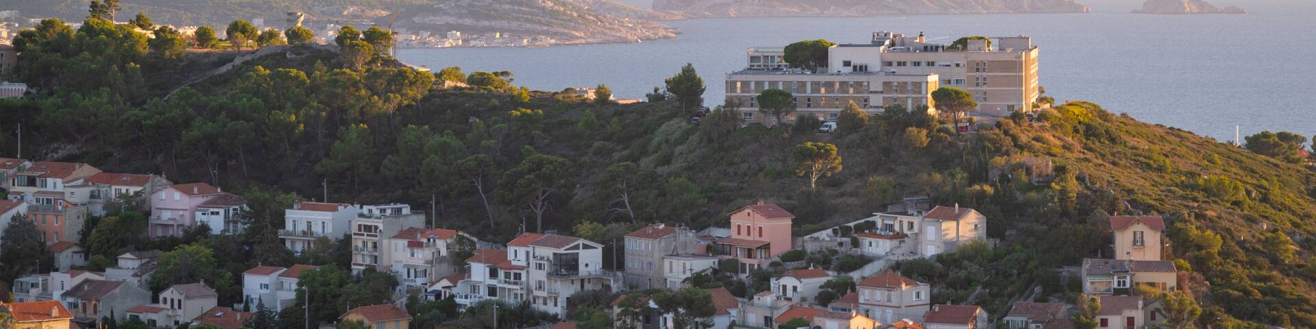 Notre-Dame de la Garde featuring general coastal views, a coastal town and a sunset