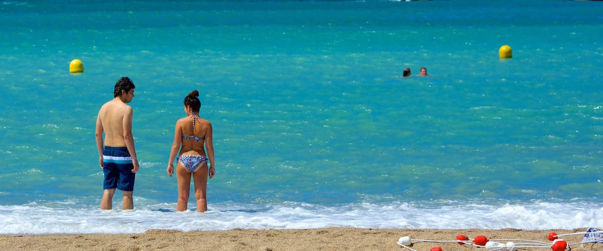 Prado Beach which includes swimming, general coastal views and a beach