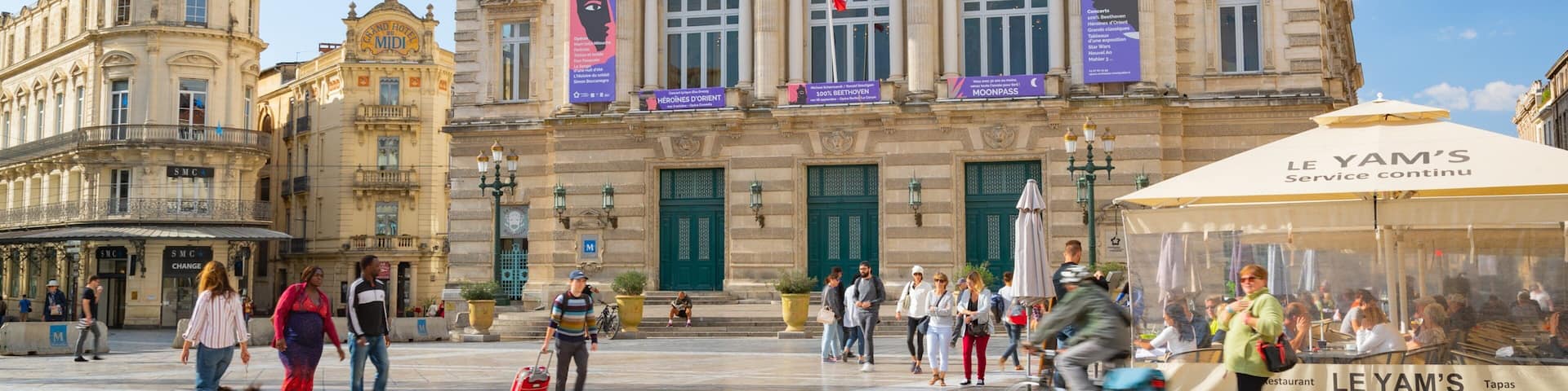 Comedy Square featuring street scenes and heritage architecture as well as a small group of people